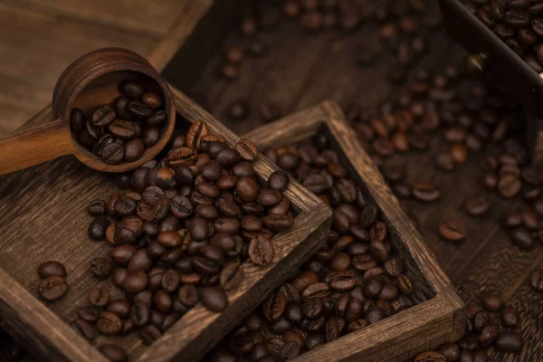 a wooden bowl with coffee beans in it beset coffee online